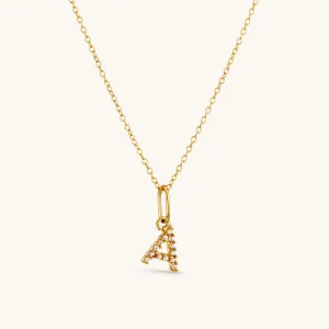 A Crystal Initial Necklace in Gold