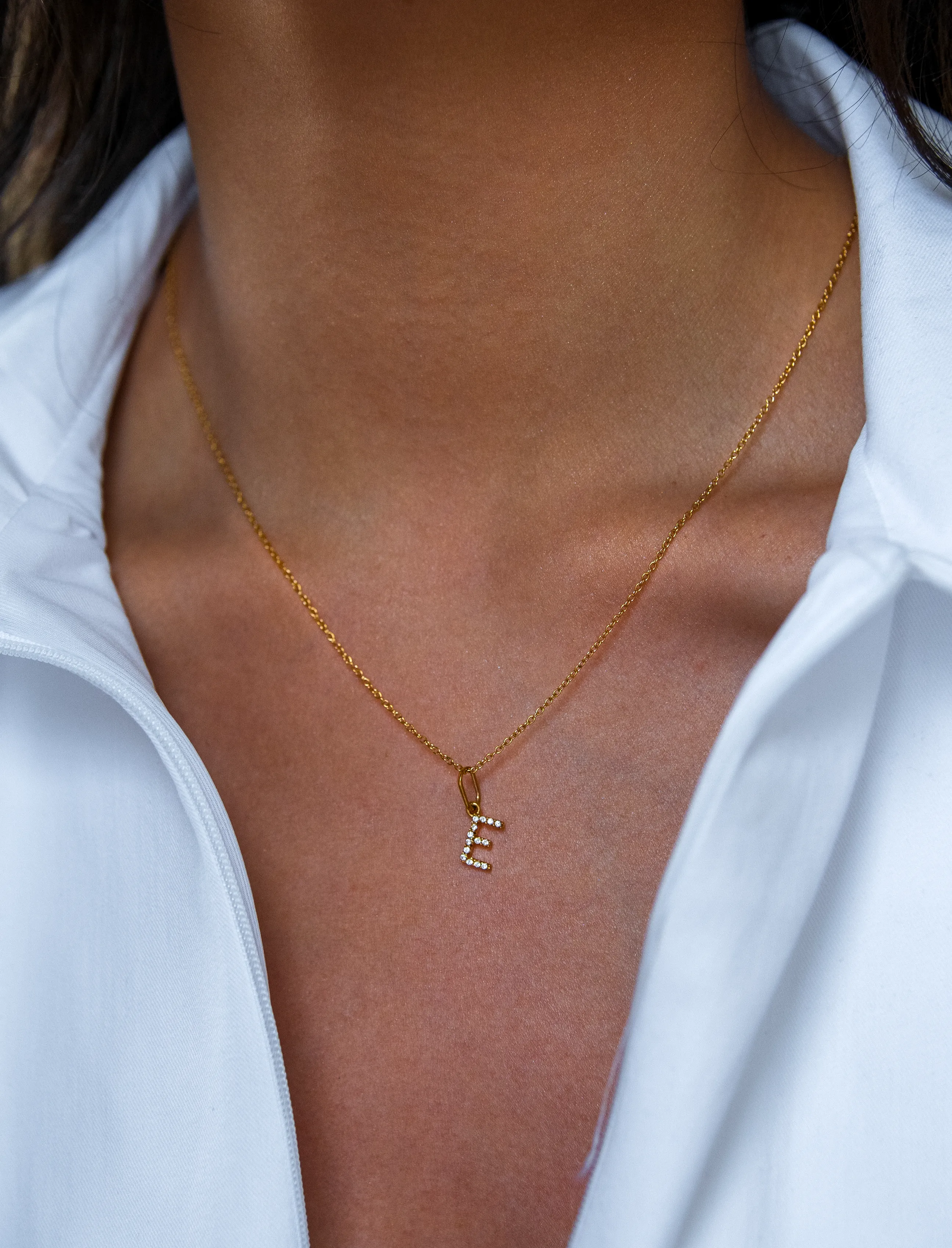 A Crystal Initial Necklace in Gold