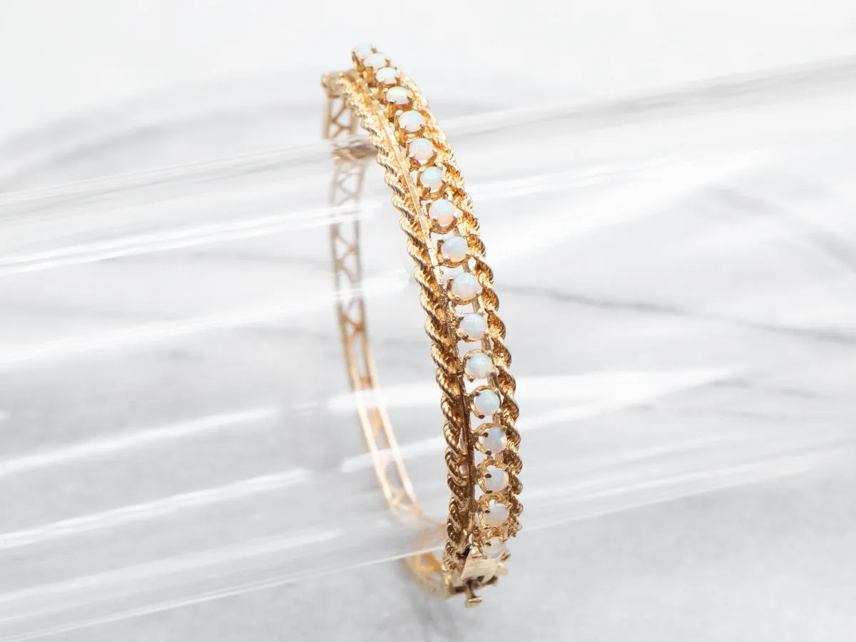 Twisting Gold and Opal Bangle Bracelet